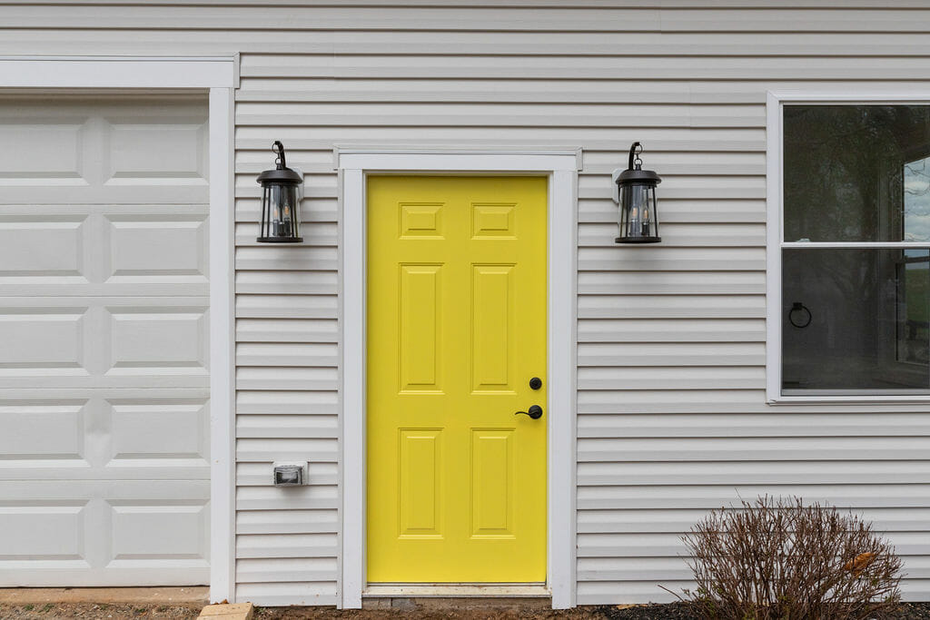 In-Law suite in Marshall, VA, Inviting and cheerful yellow door leading to the in-law suite, Additions, Golden Rule Builders