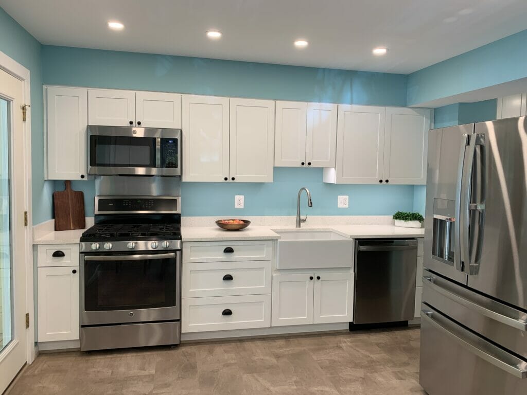 Blue Kitchen remodel in Reston - Golden Rule Builders - Kitchen remodel / renovation, Large open kitchen with a refrigerator that has a vegetable drawer and pull out freezer, and a five burner oven