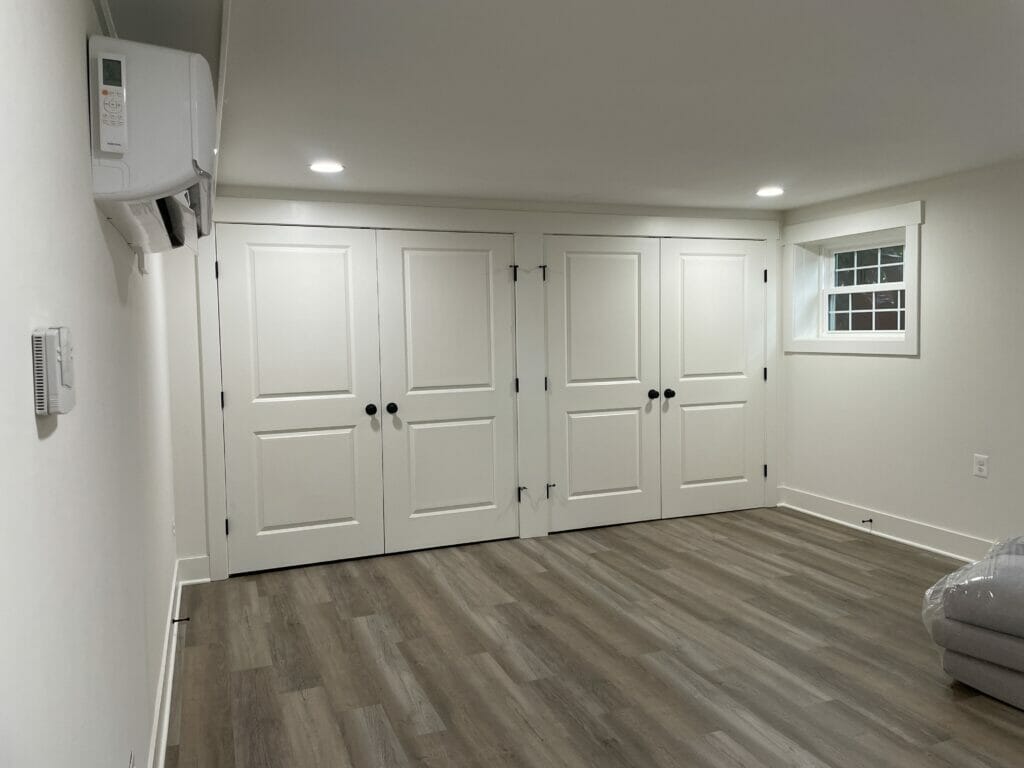 Basement remodeling / finished basement in Warrenton, VA, entertainment room with two large double door closets, Golden Rule Builders
