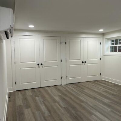 Basement remodeling / finished basement in Warrenton, VA, entertainment room with two large double door closets, Golden Rule Builders